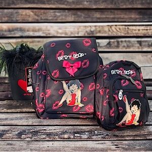 Set of three Betty Boop purses. Never used. Two with tags and backpack style.